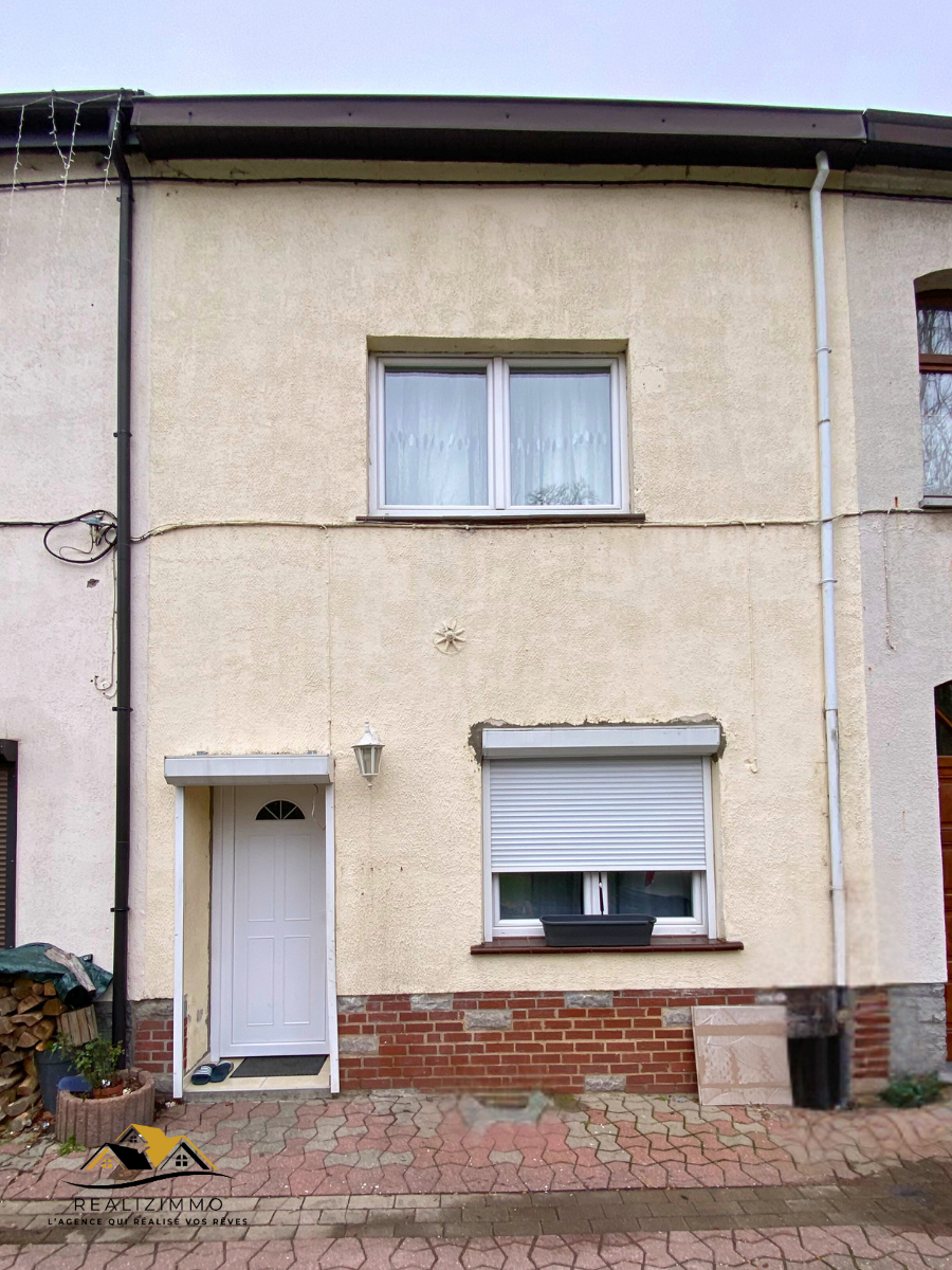 Maison deux façades avec jardin et garage